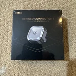 2 In One Wireless Car. Adapter Ploucey Compact Modern Android Apple Sealed. Fixed Price $67.50.